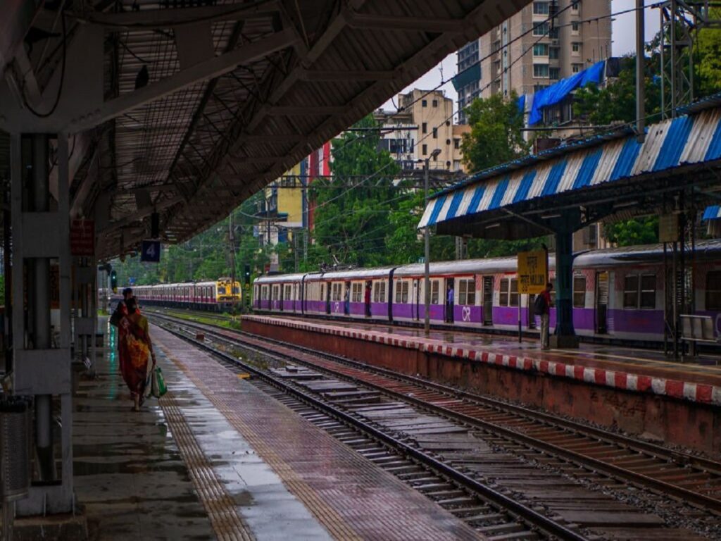 Mumbai, India - June 30, 2019 :  Mumbai Suburban Railway, one of the busiest commuter rail systems in the world having most severe overcrowding in the world, arriving at Mulund station